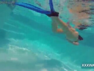 Exceptional brunette fancy woman Candy swims underwater